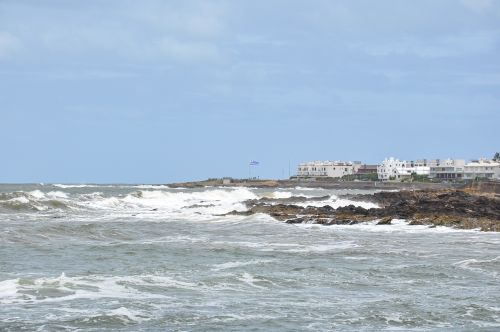 Free Breathtaking seascape with waves crashing on rocks in Punta del Este. Stock Photo