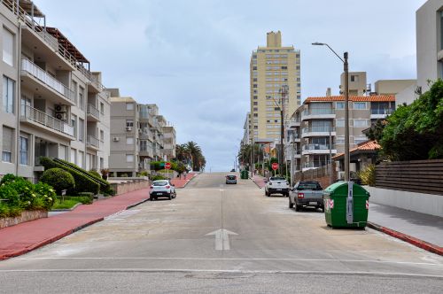 Free Scenic urban street view featuring apartment buildings in Punta del Este, Uruguay. Stock Photo