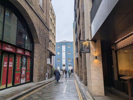 Discover a cozy urban street in winter, featuring modern architecture and a festive vibe.