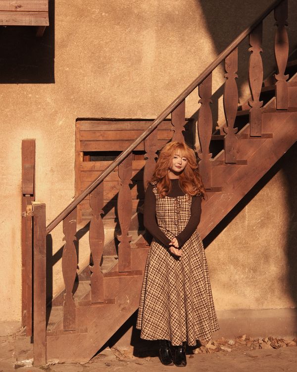 Woman in Vintage Dress by Rustic Wooden Stairs · Free Stock Photo