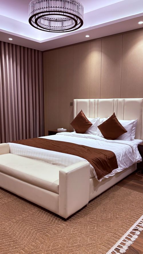 Free Sophisticated bedroom interior featuring elegant design and ambient lighting. Stock Photo