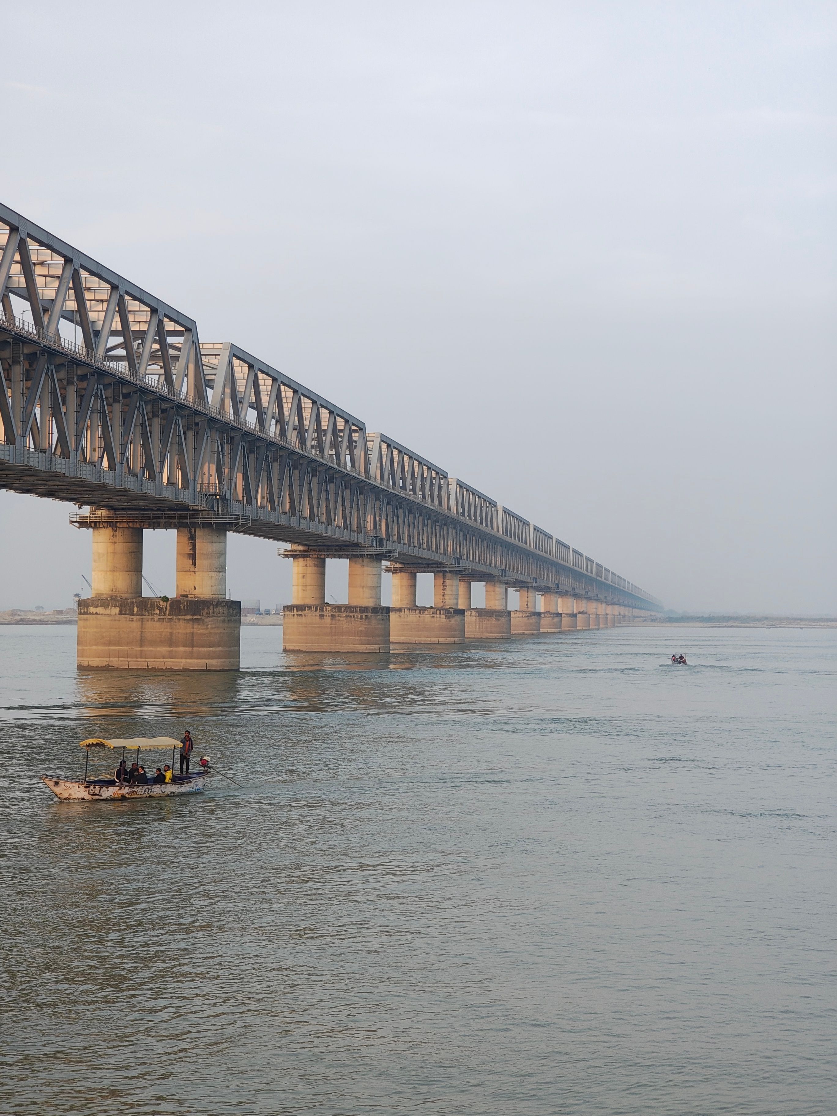 Massive Steel Railway Bridge Spanning River · Free Stock Photo