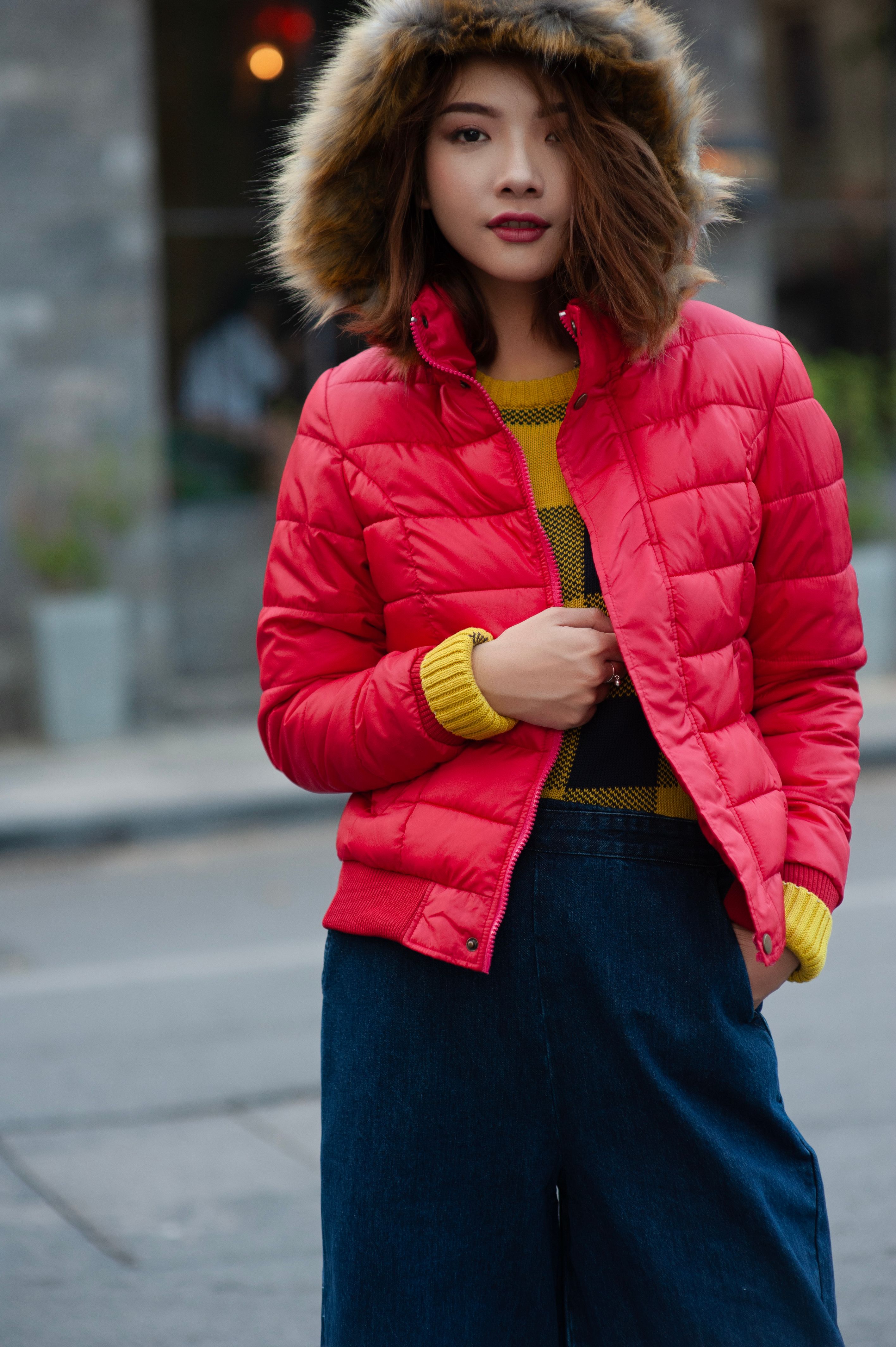 Person outdoors wearing stylish jacket