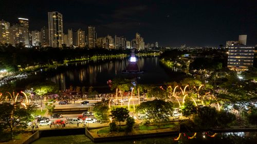 Free Aerial view of Christmas lights at Lago Igapó, Londrina, Brazil with city skyline. Stock Photo