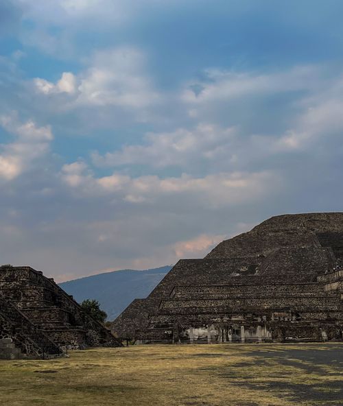 Free Stunning view of Teotihuacan pyramids under a cloudy sky, showcasing historical architecture. Stock Photo