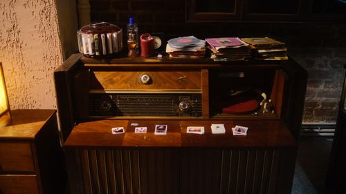 Free A cozy indoor scene featuring a vintage radio console with vinyl records, embodying nostalgic vibes. Stock Photo