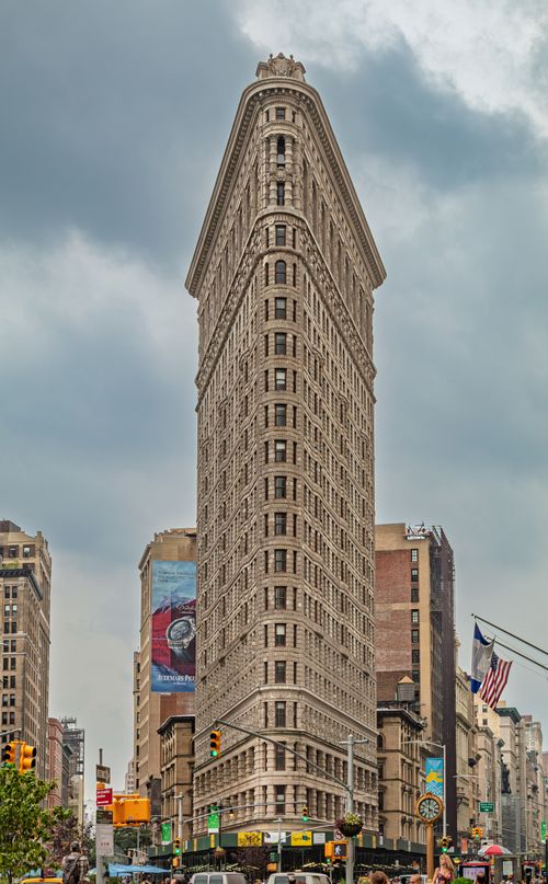 Free Iconic Flatiron Building under cloudy skies in New York City. Stock Photo