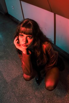 Striking portrait of a woman in dramatic lighting, casting a mysterious and engaging mood.