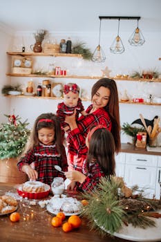 Mother and daughters baking in a festive kitchen, surrounded by holiday decorations.