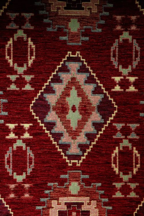 Traditional Geometric Patterned Rug in Warm Tones · Free Stock Photo