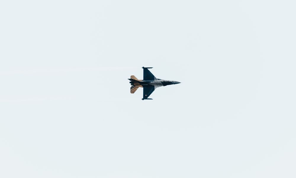 military fighter jet flying night sky
