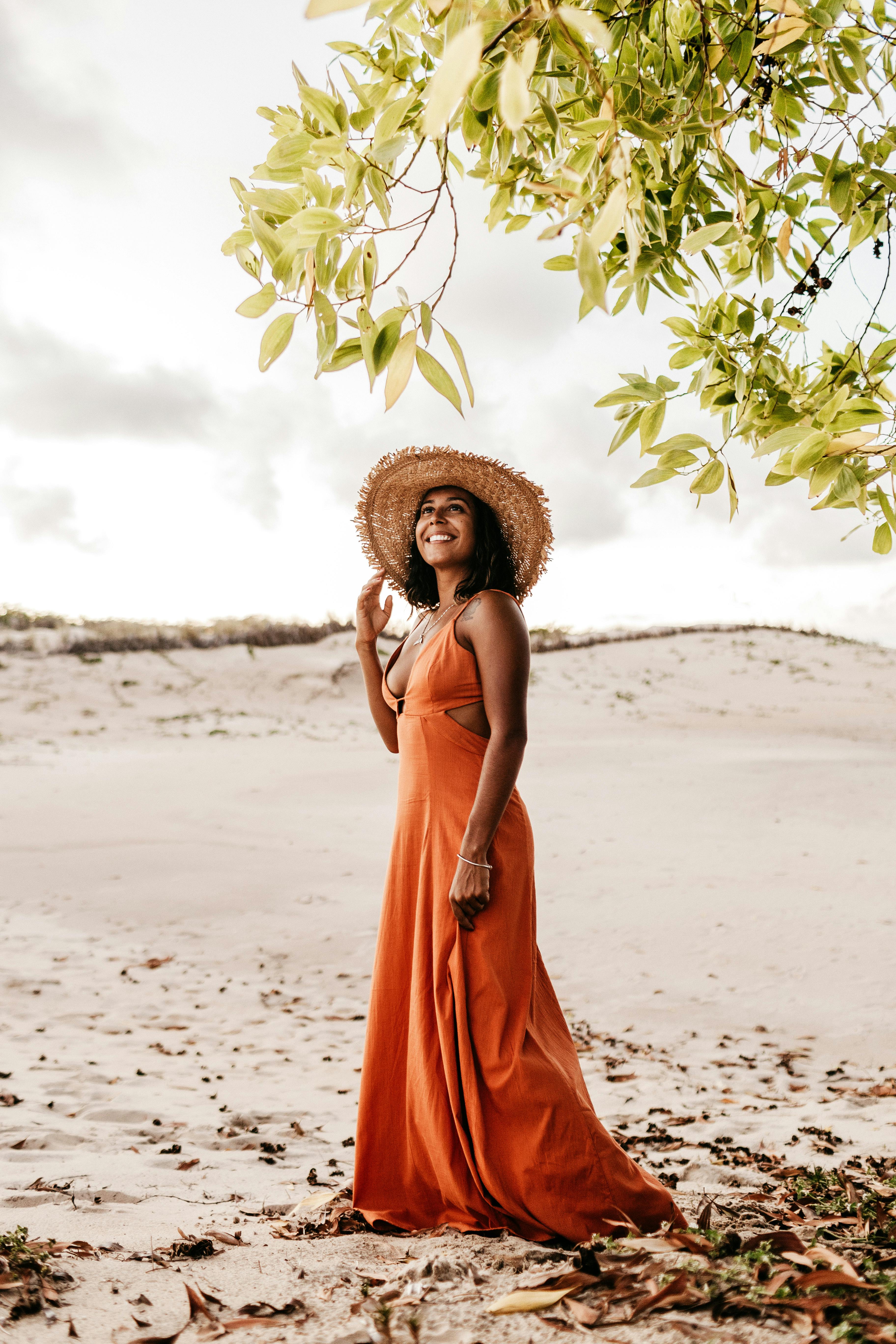 smiling woman wearing orange dress