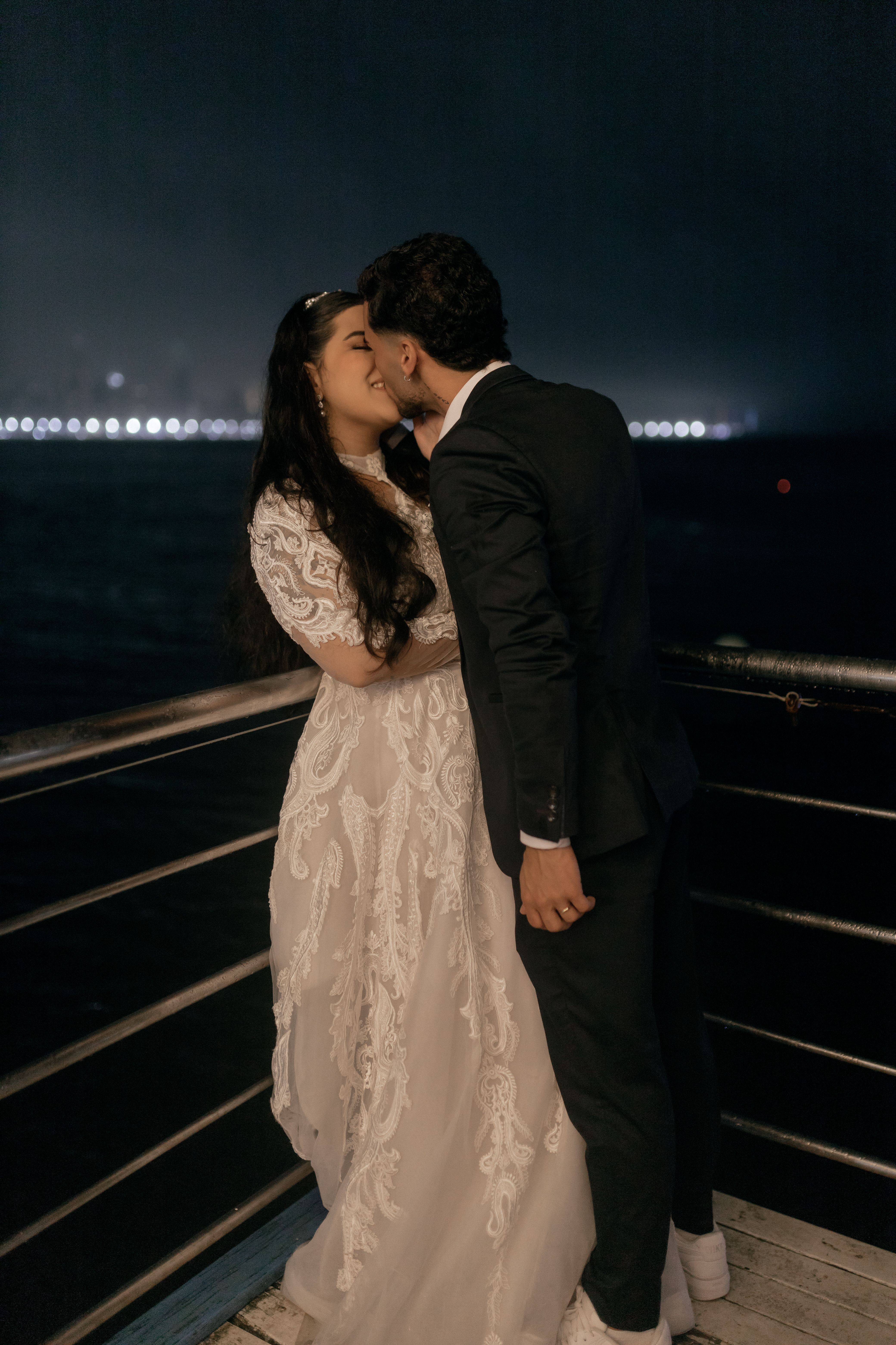 Romantic Couple Kissing at Night on a Pier · Free Stock Photo