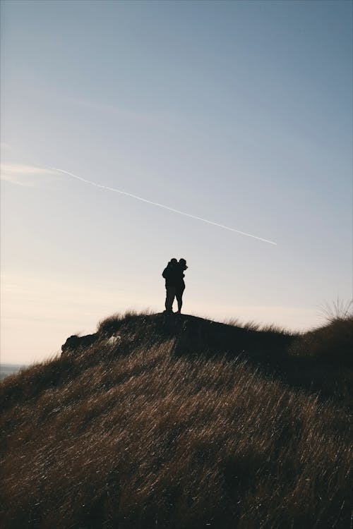 Silhouette of Person on Mountain