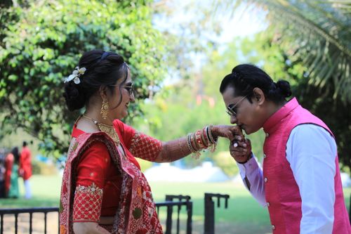 Free A stylish Indian couple shares a romantic moment in vibrant traditional attire, outdoors. Stock Photo