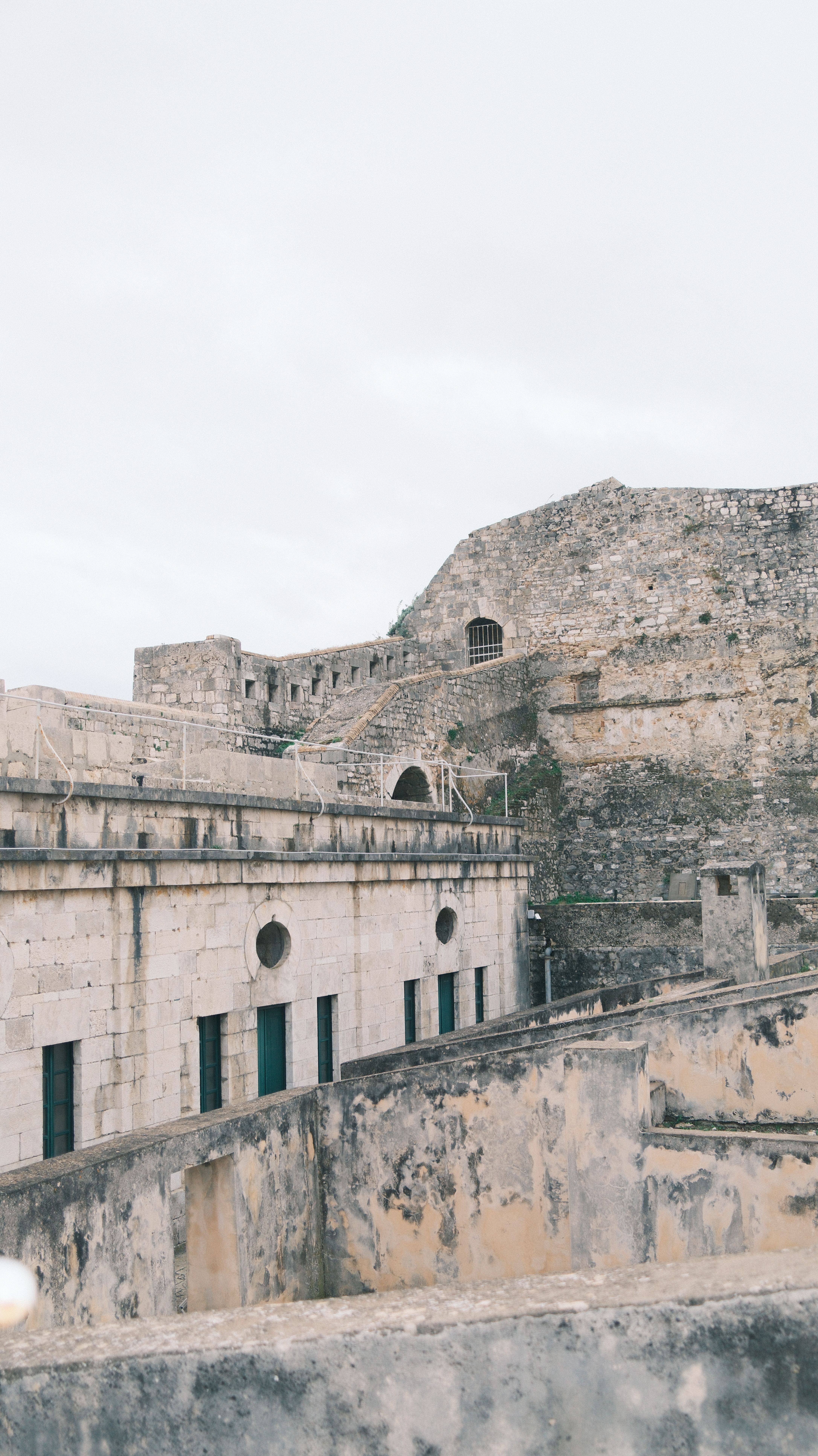 Historic Stone Fortification on Overcast Day · Free Stock Photo