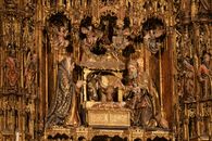 Intricate nativity scene with Mary, Joseph, golden altar decor and angels.