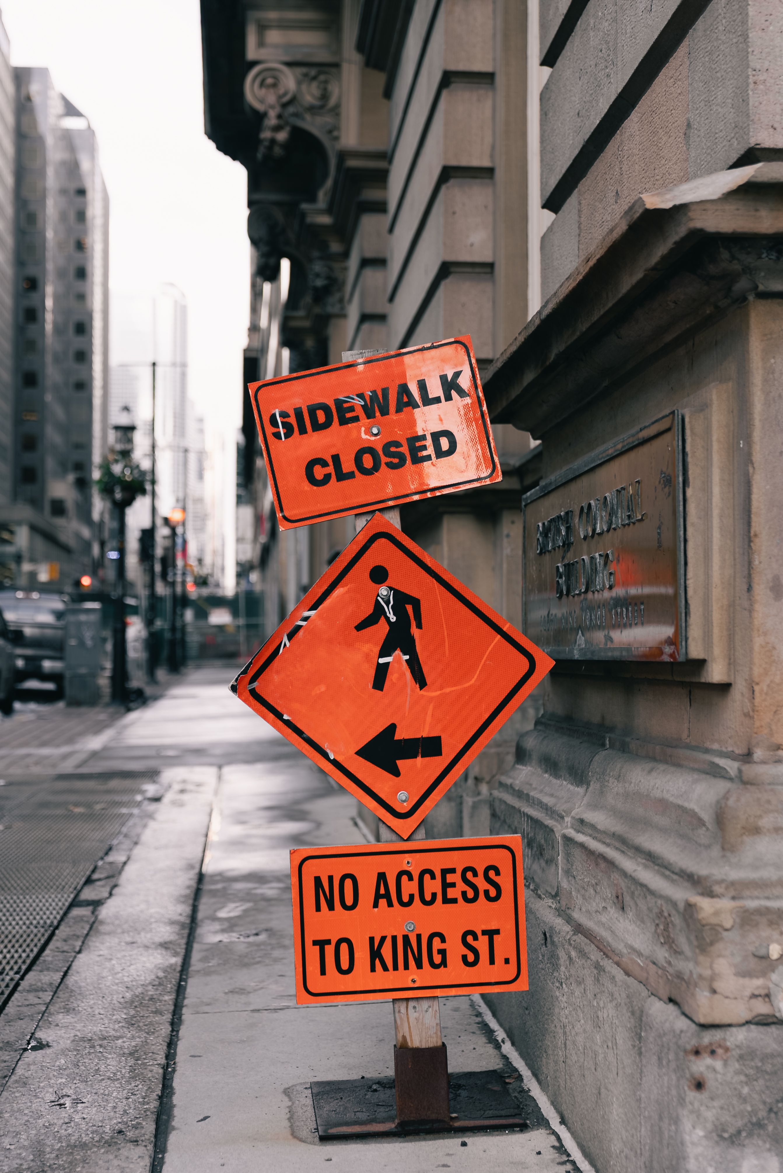 Urban Street with Sidewalk Closure Signs · Free Stock Photo
