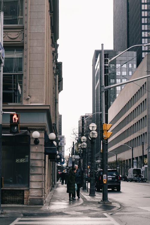 Free Moody urban street view in a modern downtown with pedestrians and high-rise buildings. Stock Photo