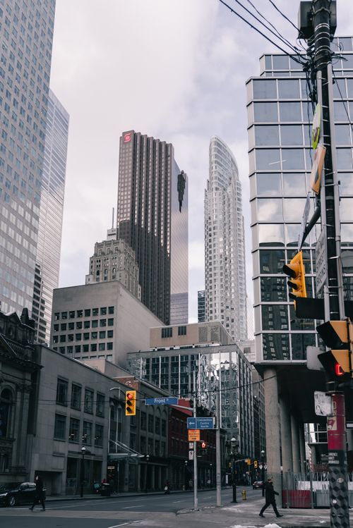 Free A bustling city street surrounded by modern skyscrapers and urban architecture. Stock Photo