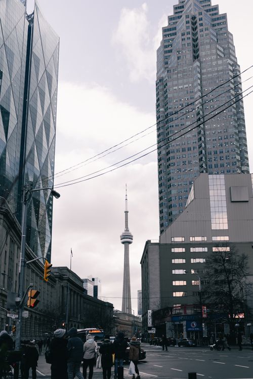 Free Street view of Toronto's architecture featuring the iconic CN Tower. Stock Photo