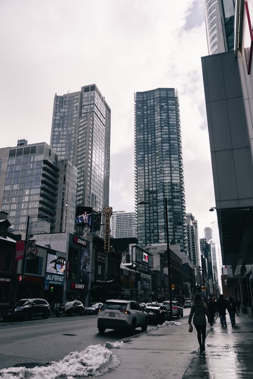 Free Busy city street with skyscrapers in winter, showcasing urban lifestyle. Stock Photo