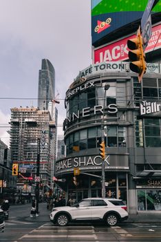 Bustling Downtown Toronto intersection showcasing vibrant urban life and modern architecture.