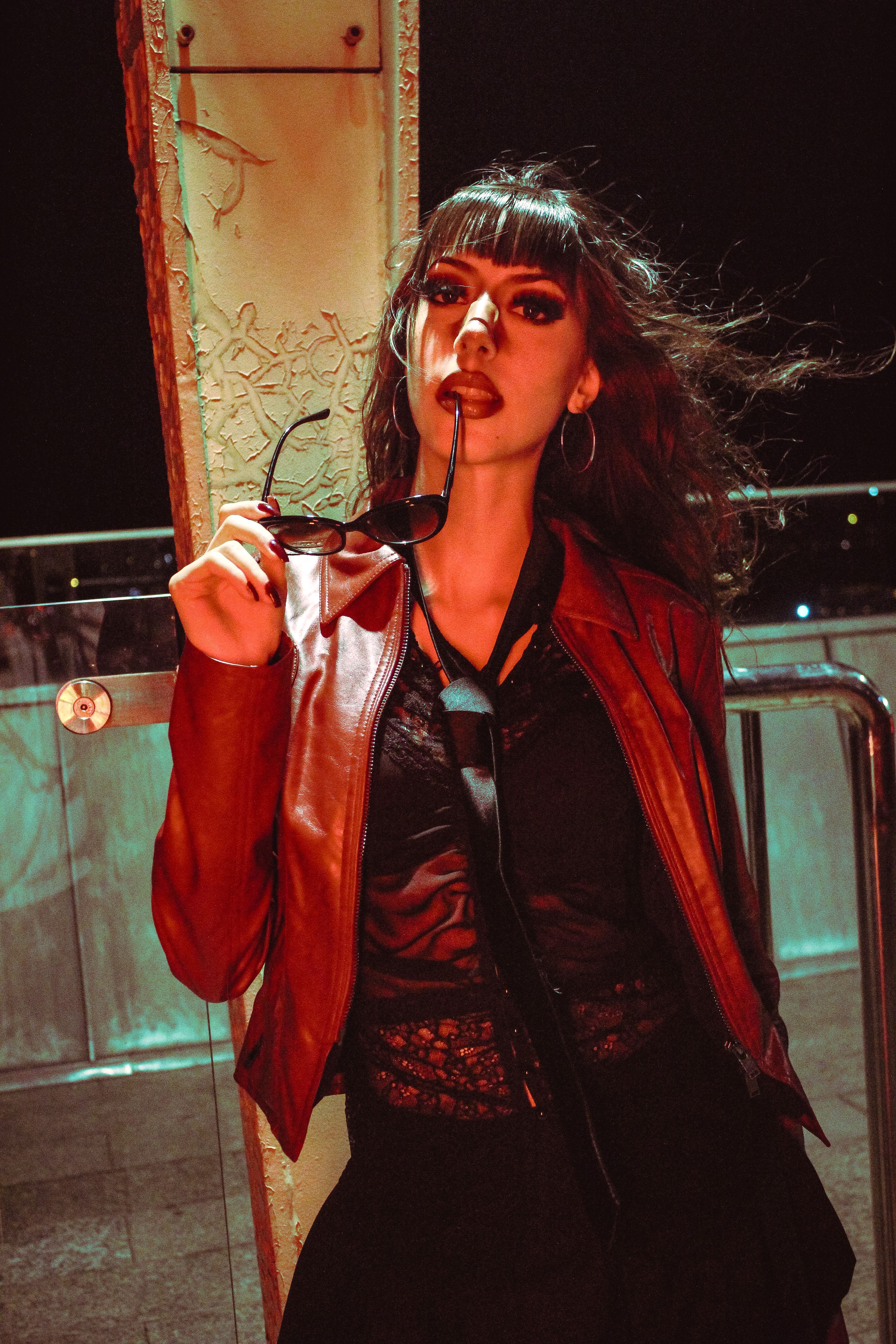woman wearing lace camisole and leather mini skirt night out