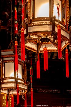 Elegant Chinese lanterns with red tassels, showcasing traditional Asian craftsmanship.