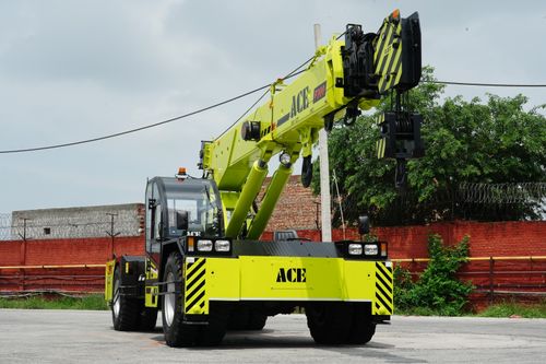 Free Bright yellow ACE 30 ton mobile crane in Faridabad, India, industrial area. Stock Photo