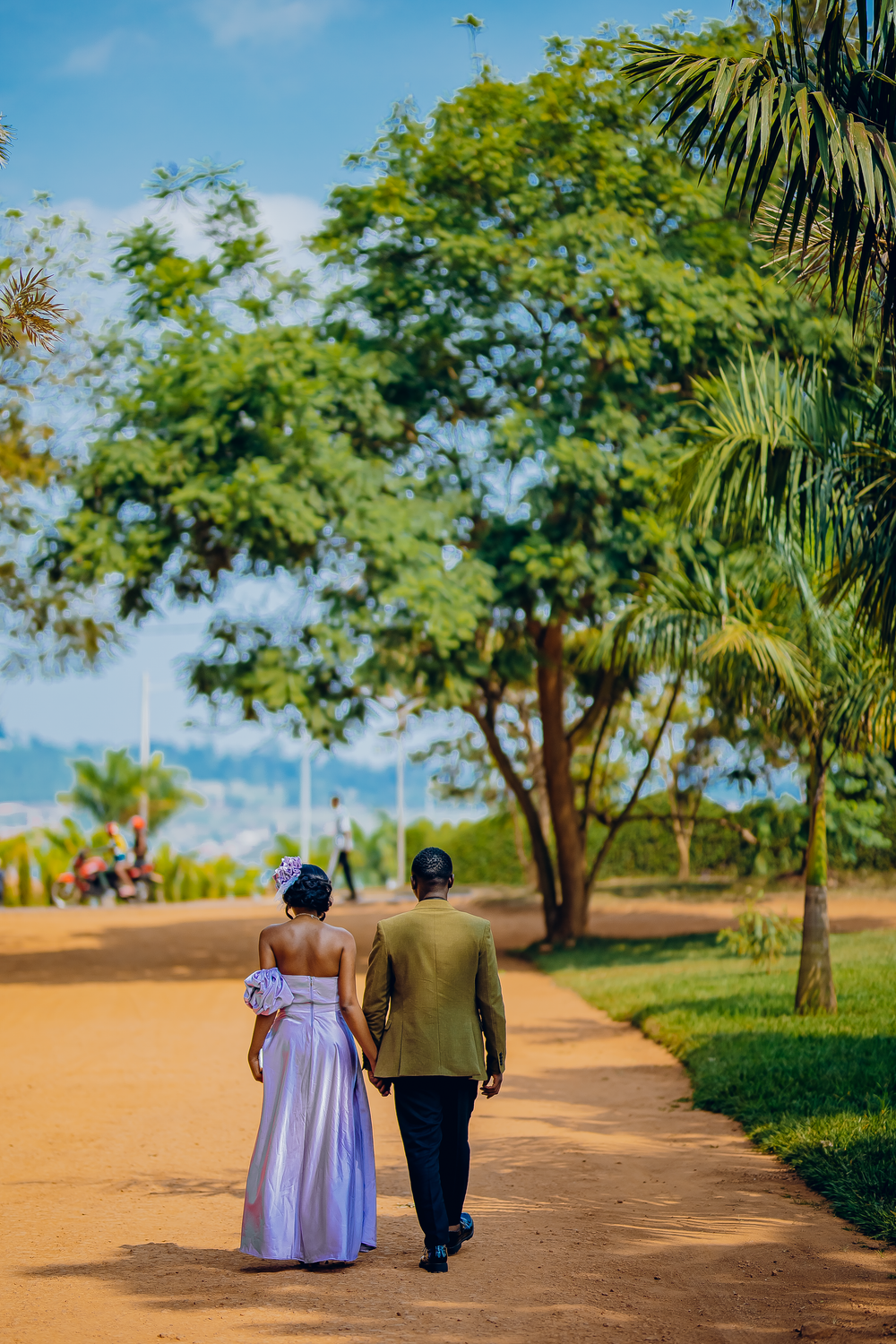 Couple Walking in Lush Green Park · Free Stock Photo