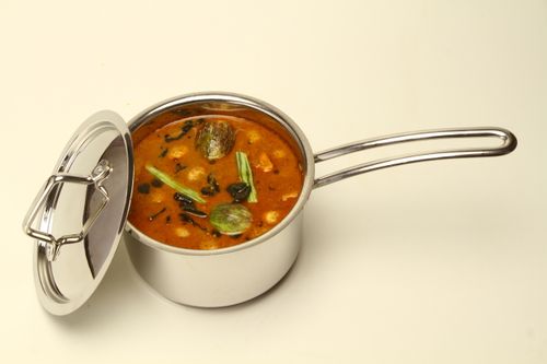 Free Delicious Indian sambar in a stainless steel pot, showcasing vibrant ingredients. Stock Photo