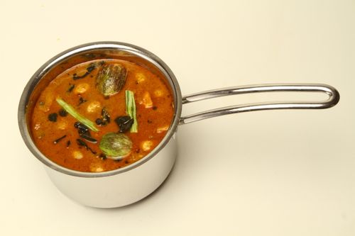 Free Delicious South Indian sambar with drumstick and eggplant in a stainless steel pot. Stock Photo