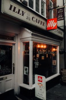 Cozy Illy café in Conwy, Wales with warm lighting and inviting atmosphere.