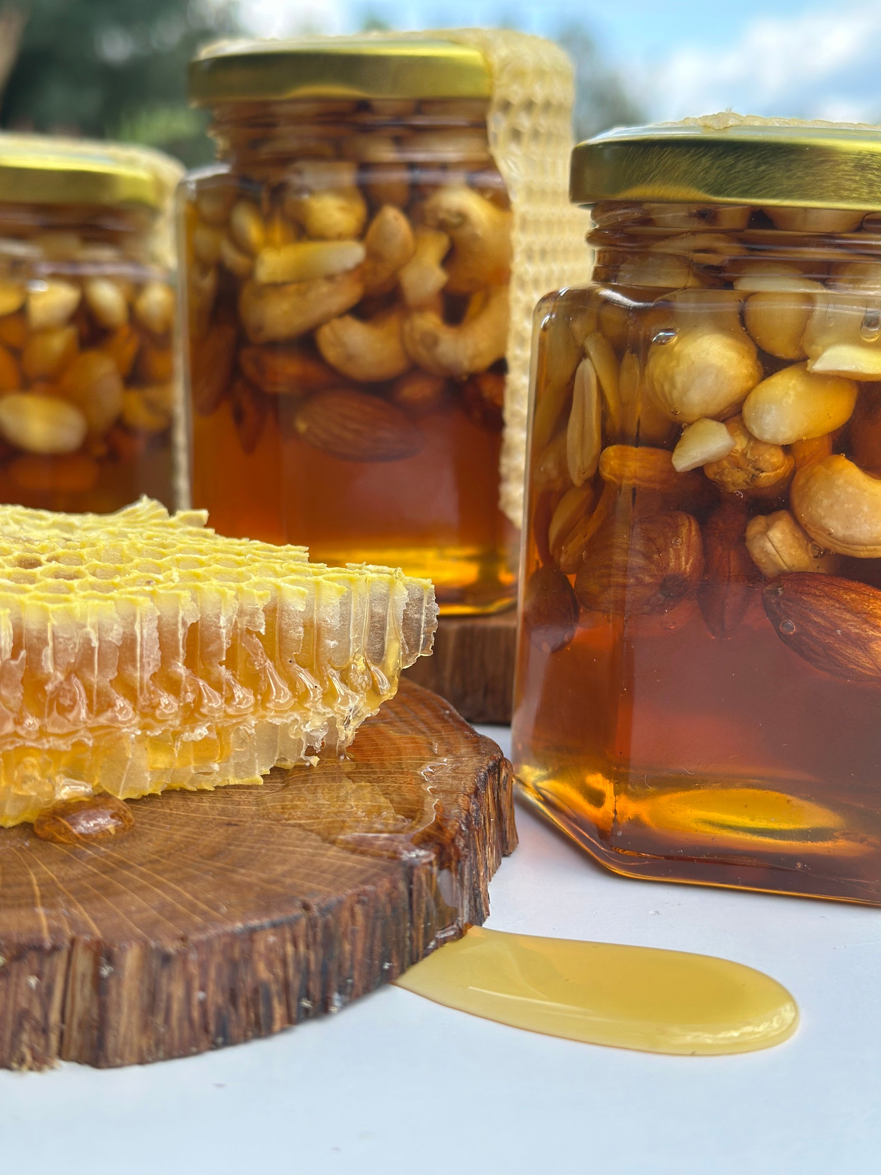 Golden honey with nuts in glass jars, perfect for healthy snacking. - Comparisons of Different Types of Honey