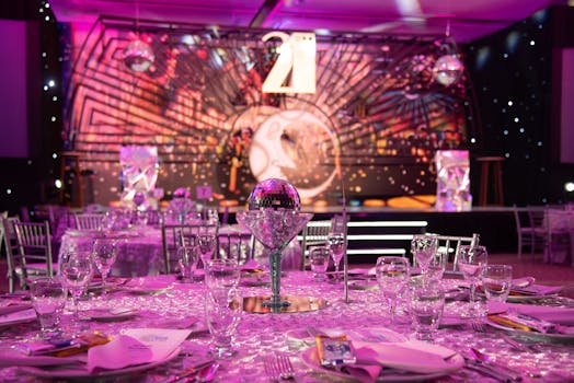 Luxurious dining setup for a 21st birthday party with a sparkling modern theme.