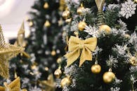 Festive Gold Decorated Christmas Tree with Bow