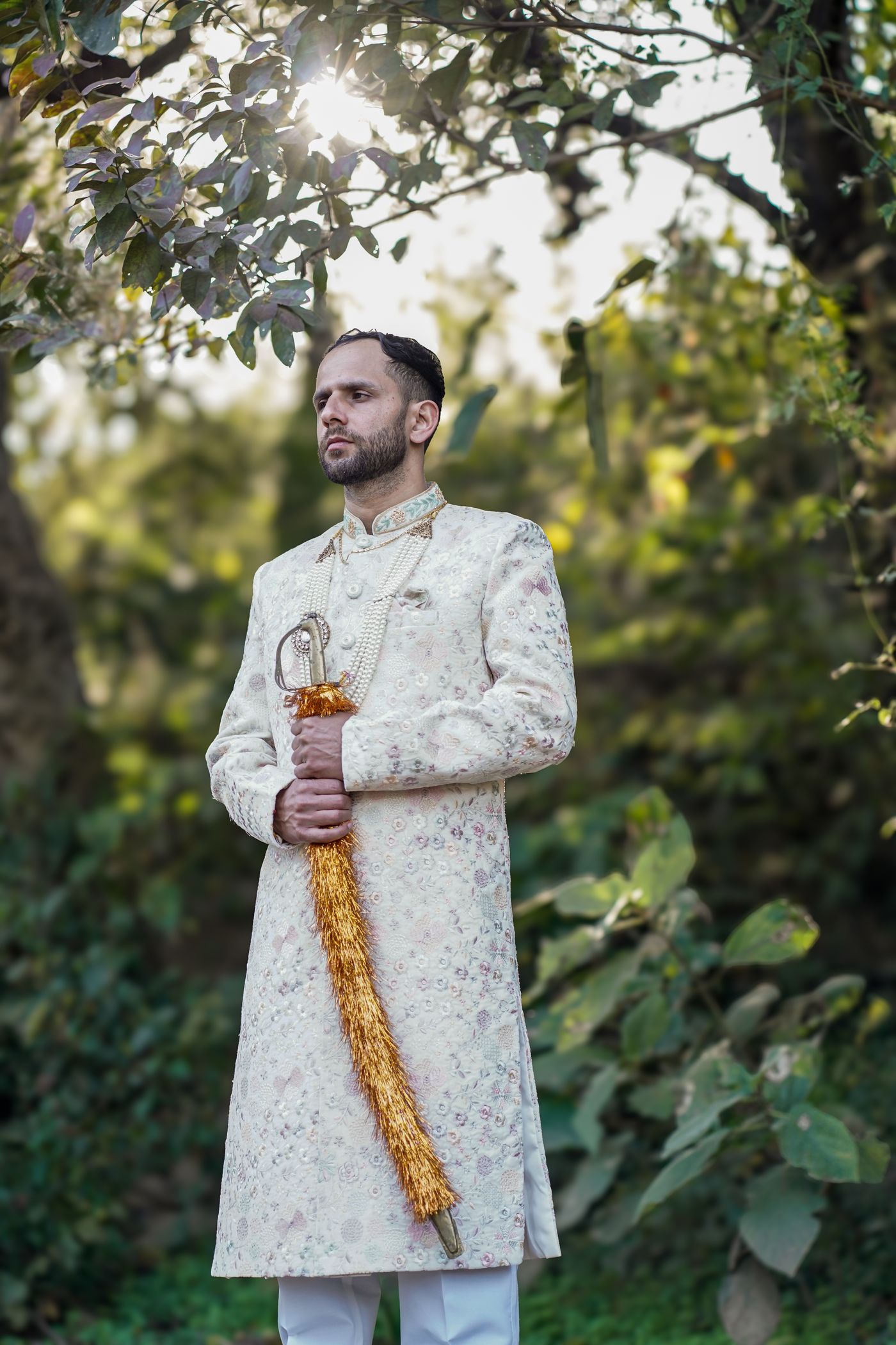 Groom in traditional sherwani ensemble