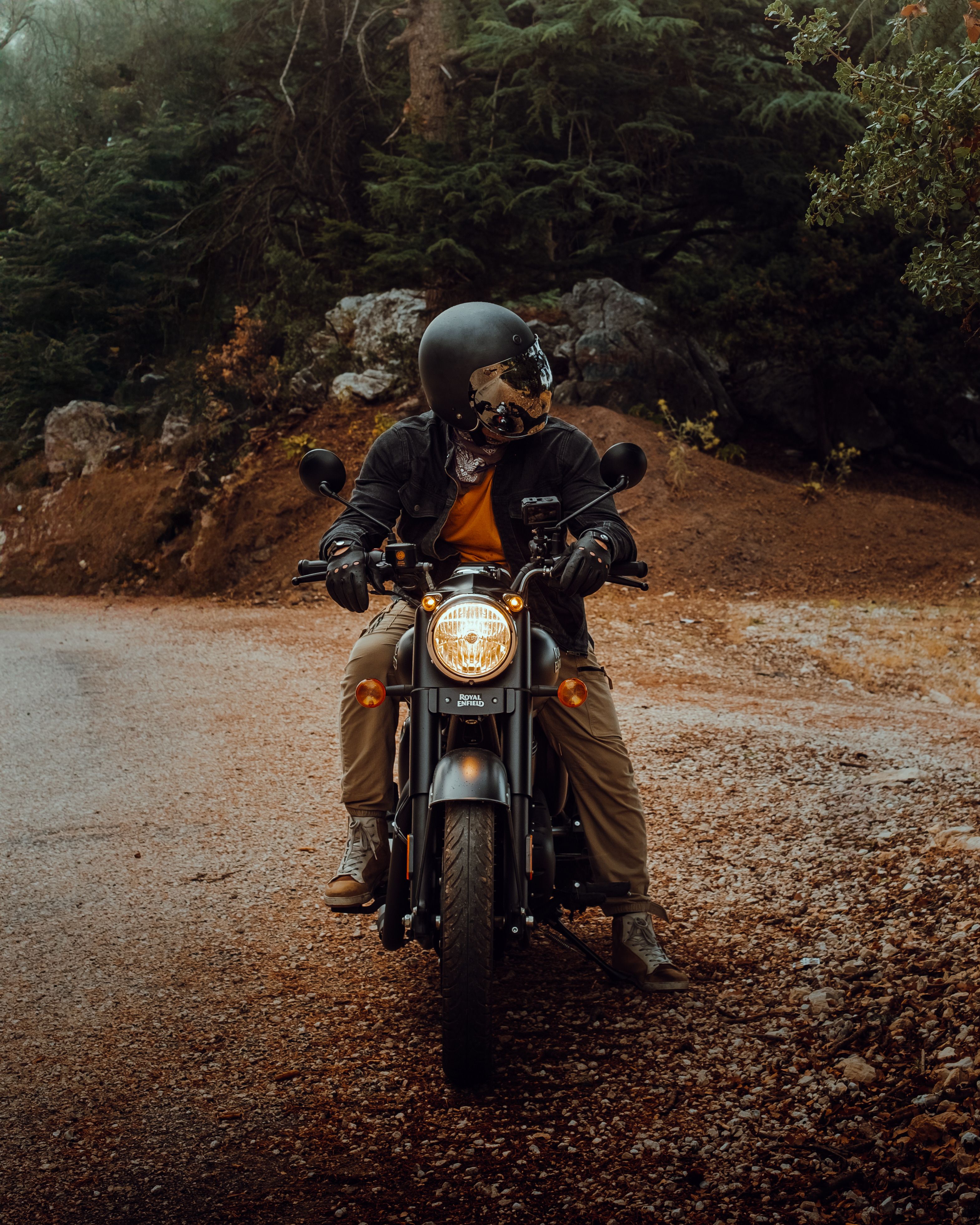 Motorcyclist Riding Vintage Bike on Rustic Road · Free Stock Photo