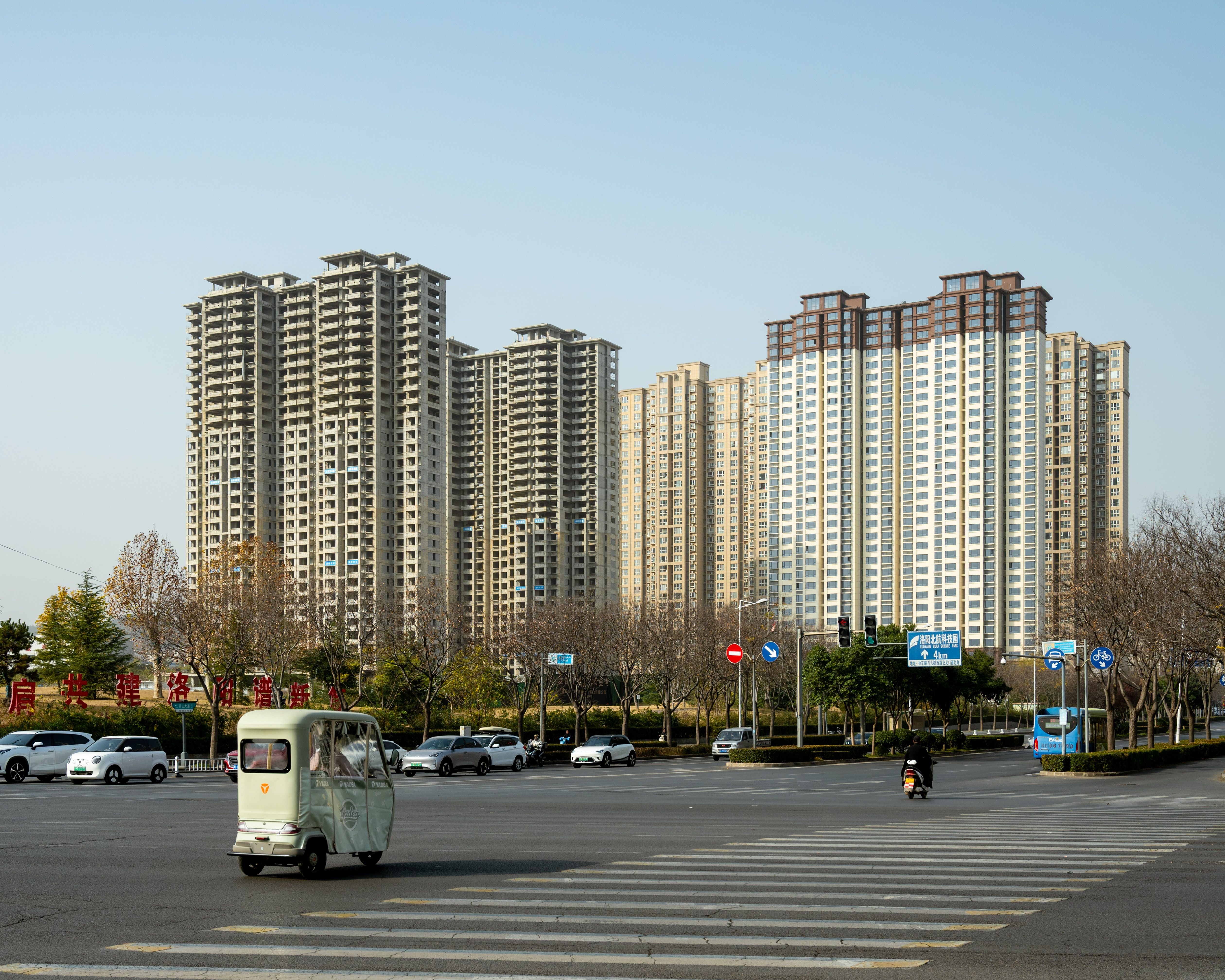 High-rise buildings and traffic at a busy intersection in Luoyang, China.