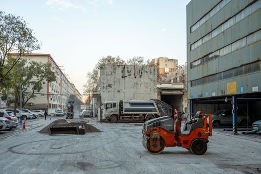 Urban construction site with machinery in Luoyang, China, during daytime.