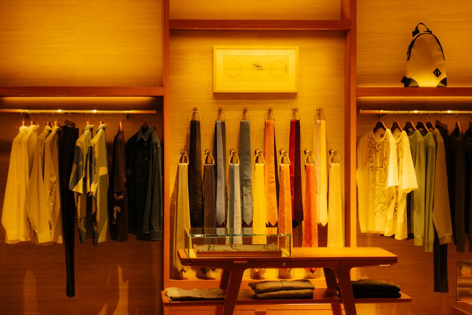Display stands for apparel in modern shopping mall with folding garment racks