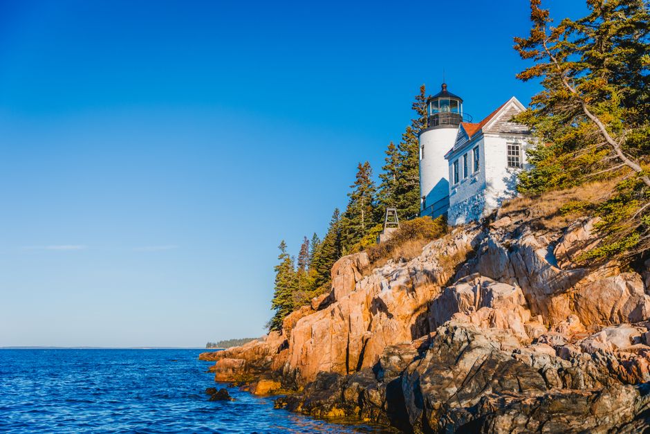 Discover the serene beauty of Bass Harbor Head Lighthouse against a stunning coastal landscape in Maine.