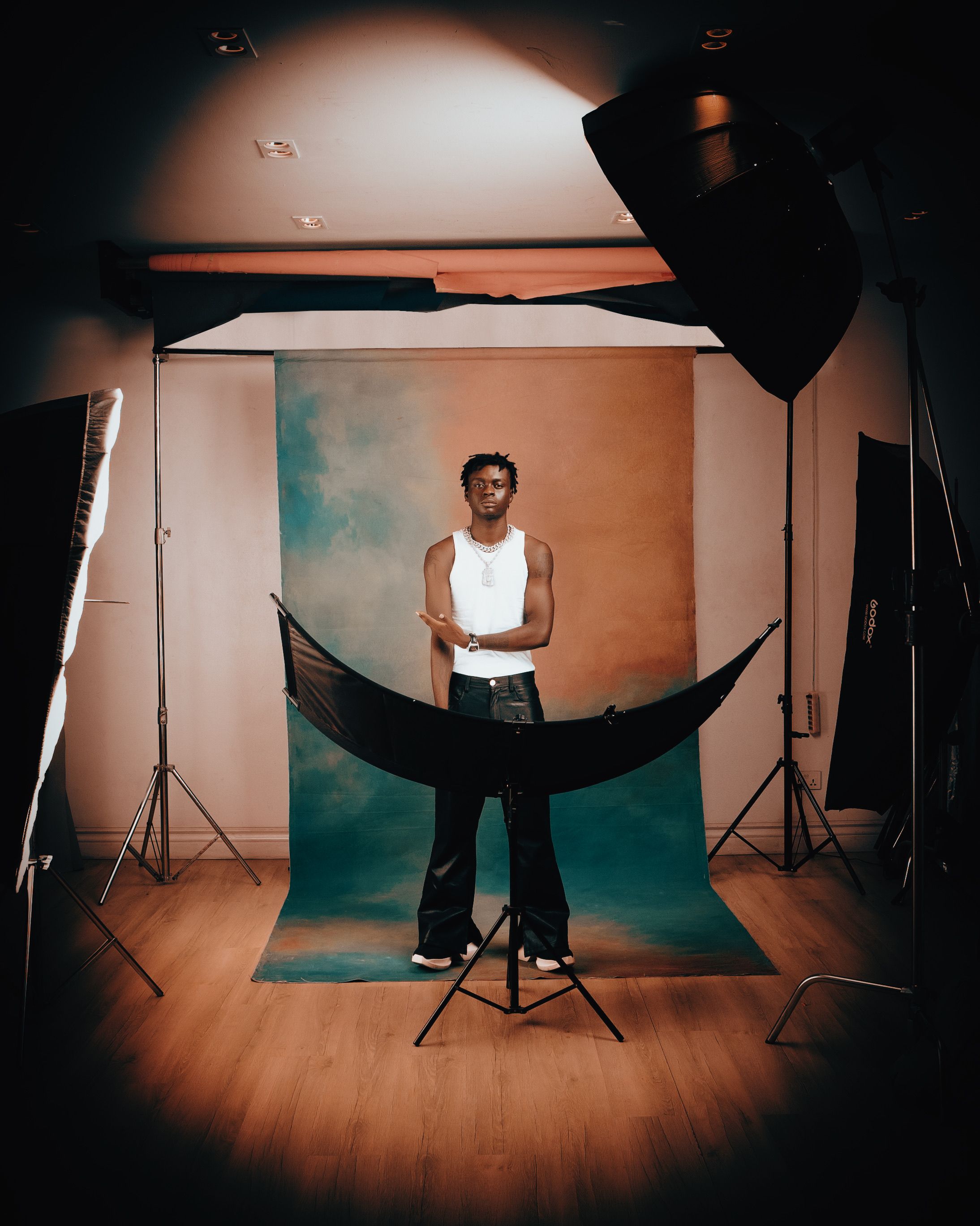 Professional studio portrait of a modern male model with artistic lighting.