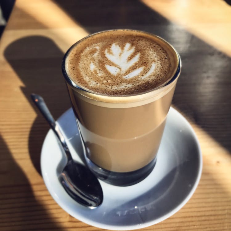 Cappuccino Filled Glass On Saucer