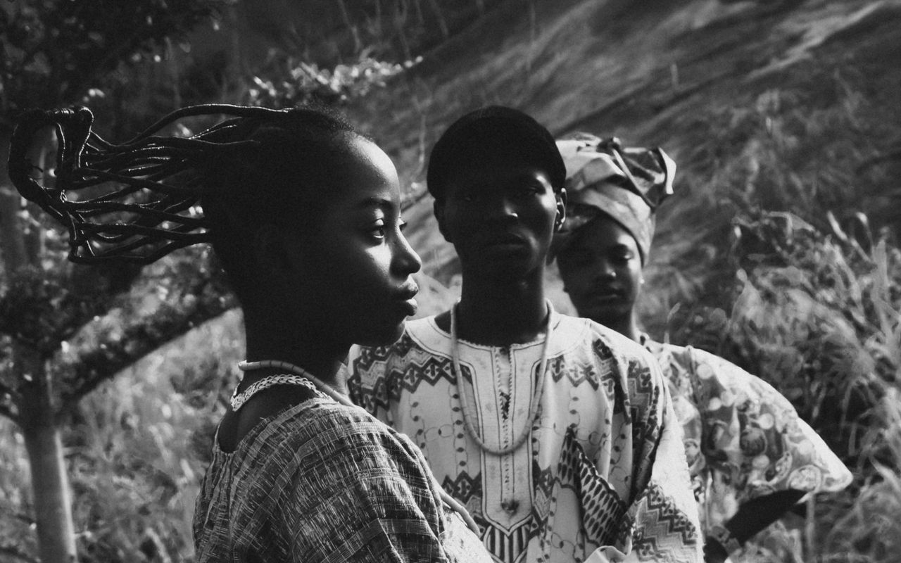 artistic black and white portrait of people in traditional african clo