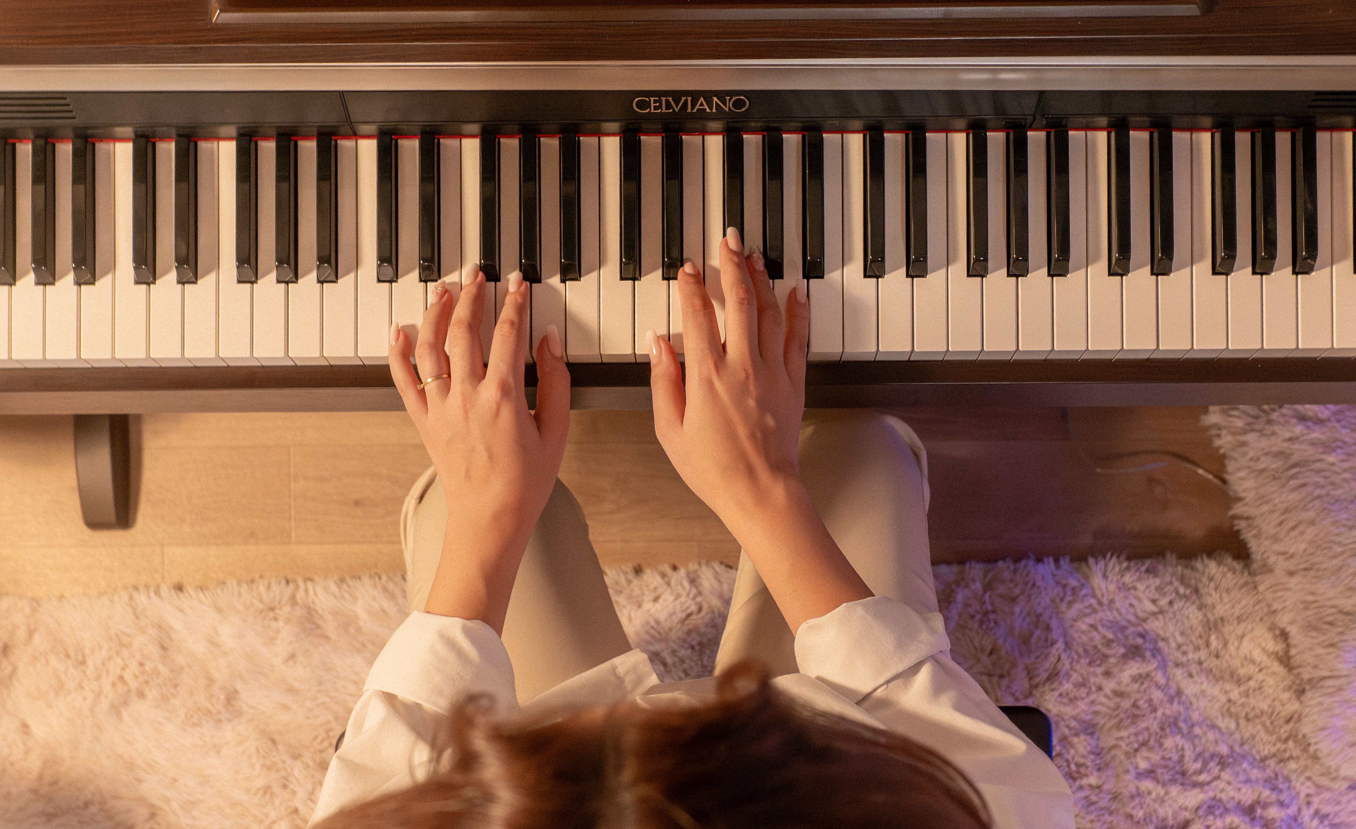 Hands Playing Piano Keyboard from Above · Free Stock Photo