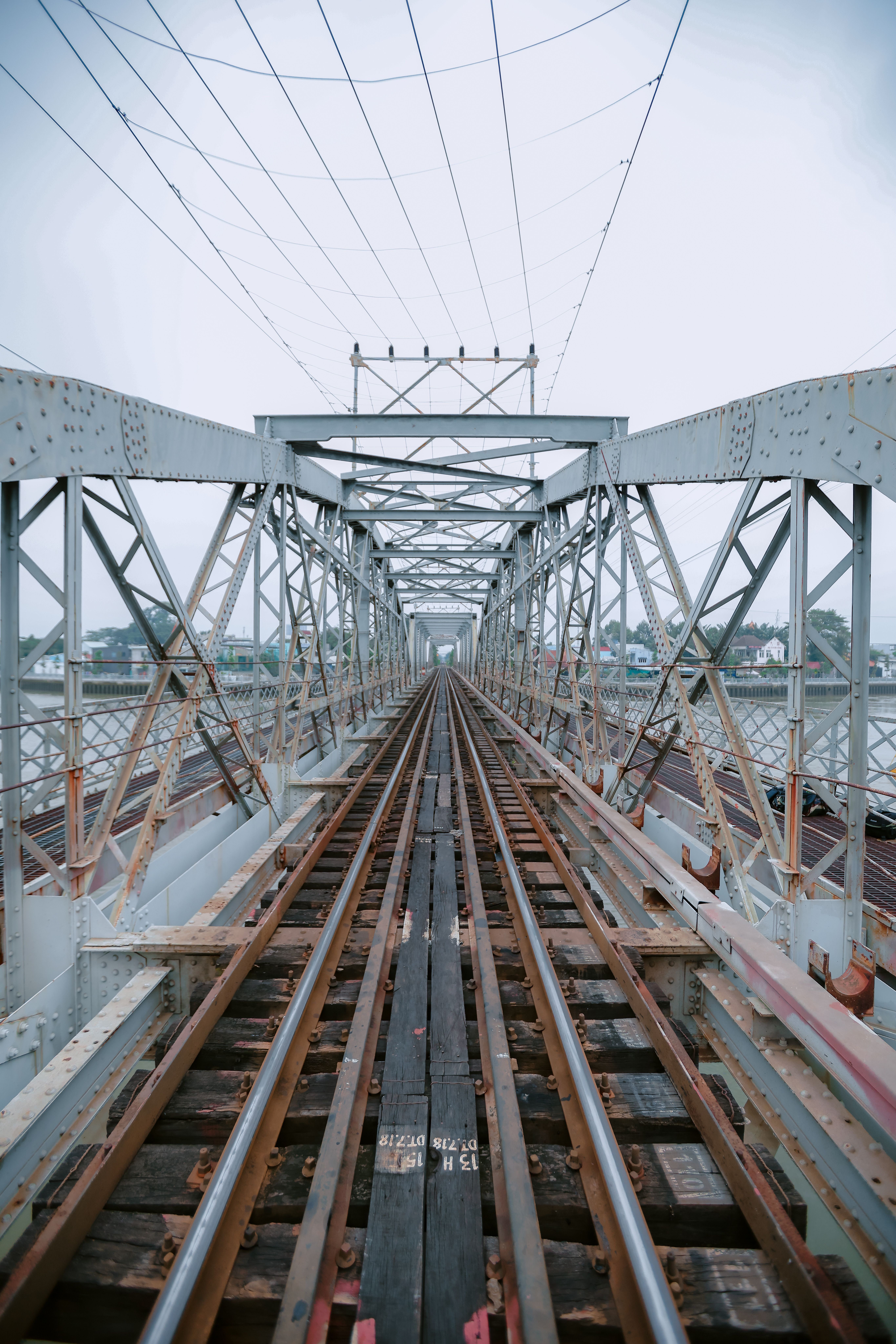 Symmetrical View of Railway Through Bridge · Free Stock Photo