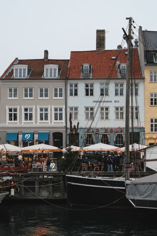 Free Capture of historic buildings and boats at Nyhavn Harbor, Copenhagen. Stock Photo