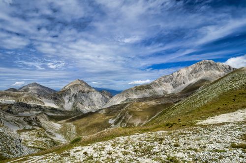 Free Breathtaking view of rugged mountains under a vivid blue sky, perfect for nature and travel themes. Stock Photo